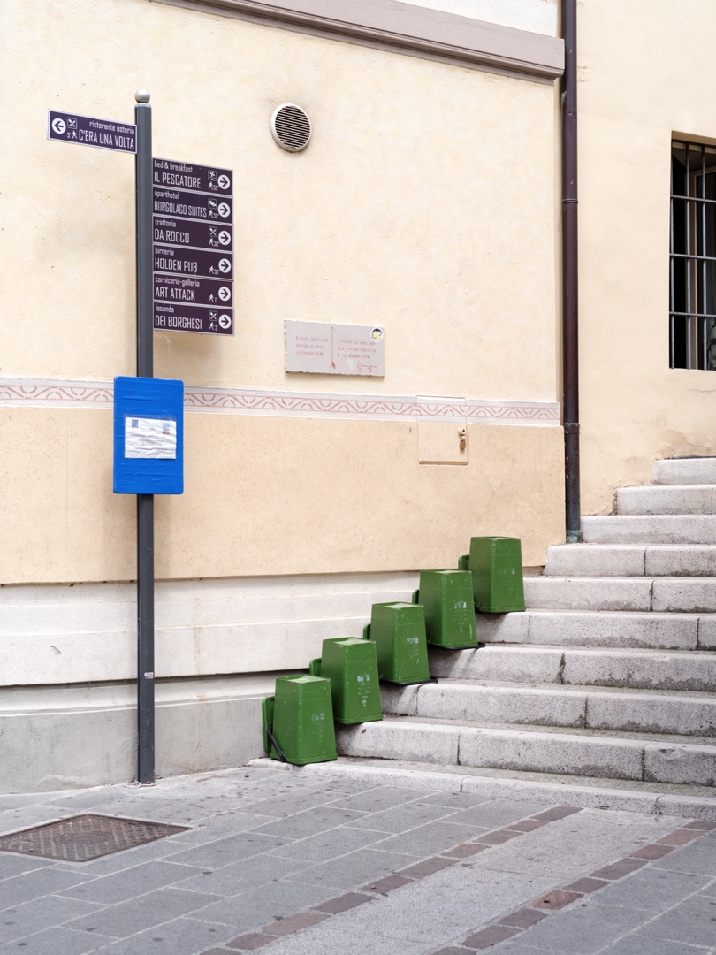 Empty trashbins drying upside down on stairs in #iseo